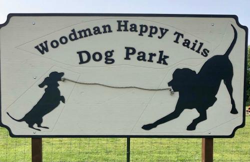Woodman “Happy Tails” Dog Park sign