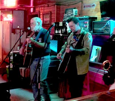Bruce and Eric Tessmer playing guitars together