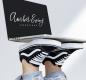 Picture of a laptop on feet that says Amber Ewing Creations